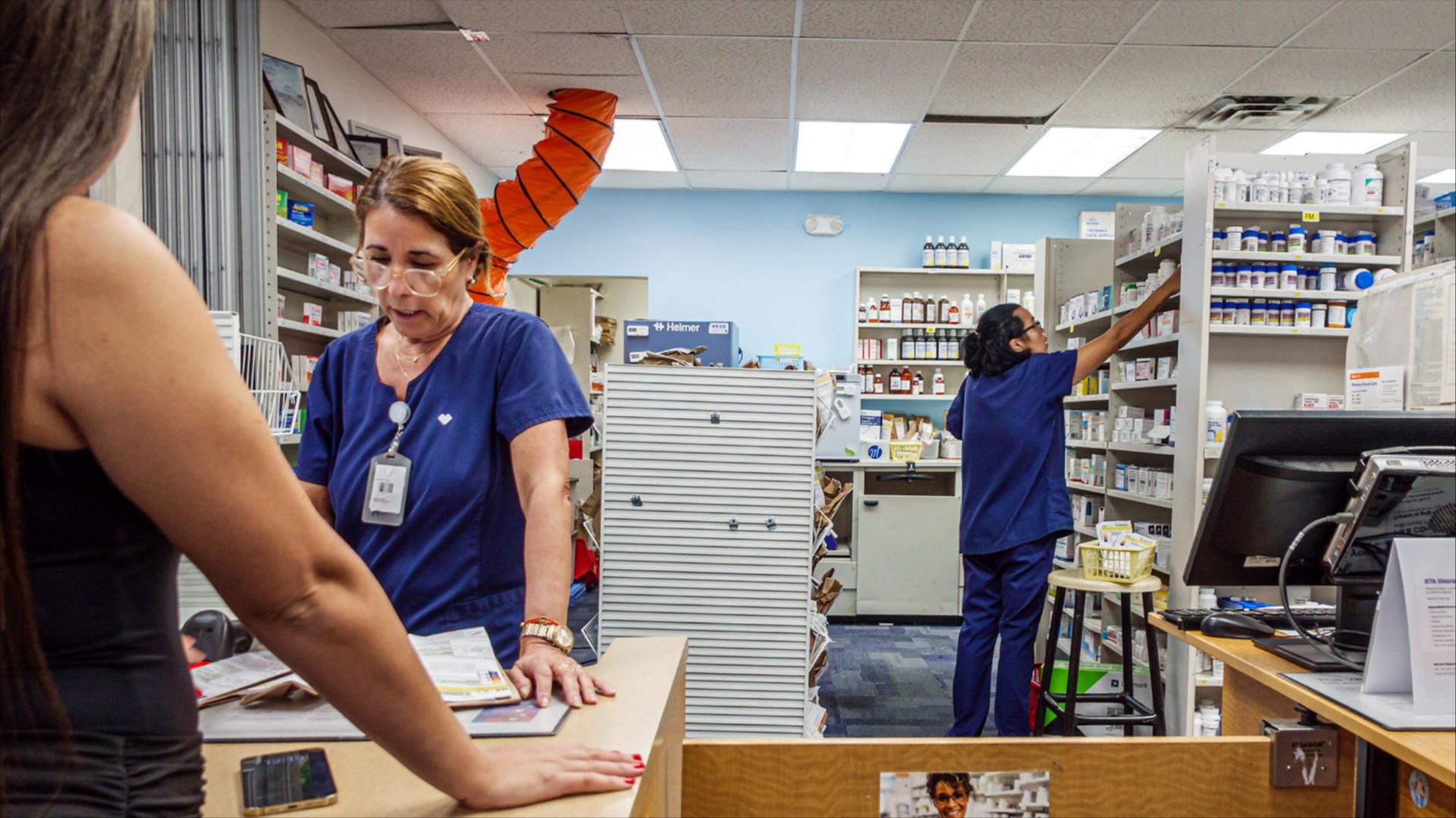 Two pharmacists at work at a CVS Pharmacy