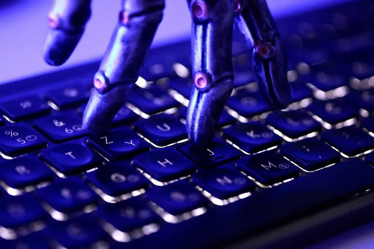 A keyboard and robotic hand illustration, June 2026