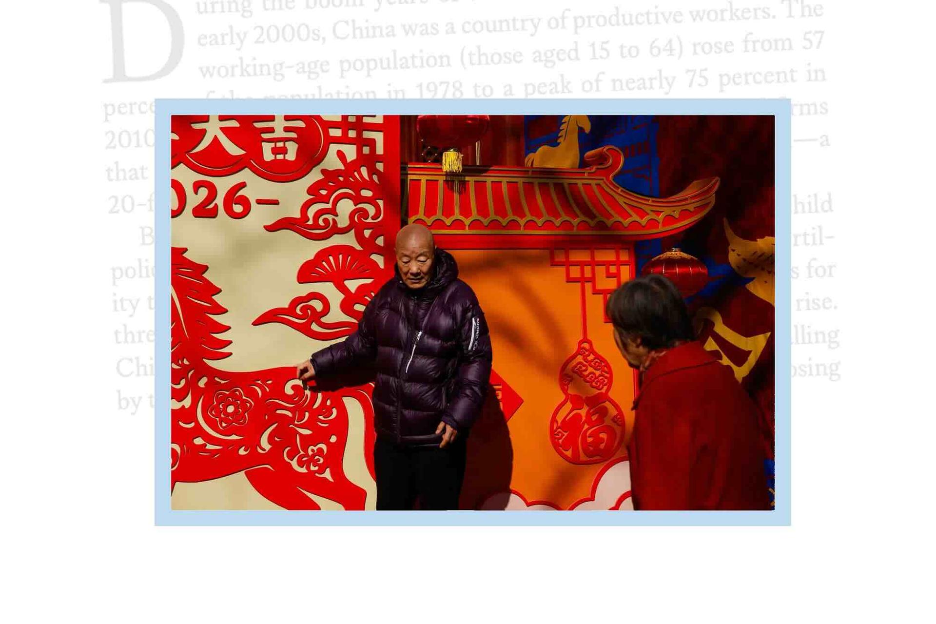 Elderly people look on next to decorative installation on the first day of the Lunar New Year of the Horse at the Dongyue Temple in Beijing, China, February 17, 2026.
