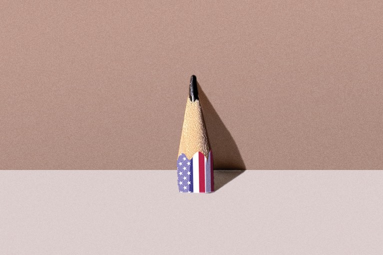 Illustration of a pencil with an American flag on it, sharpened down to a small point
