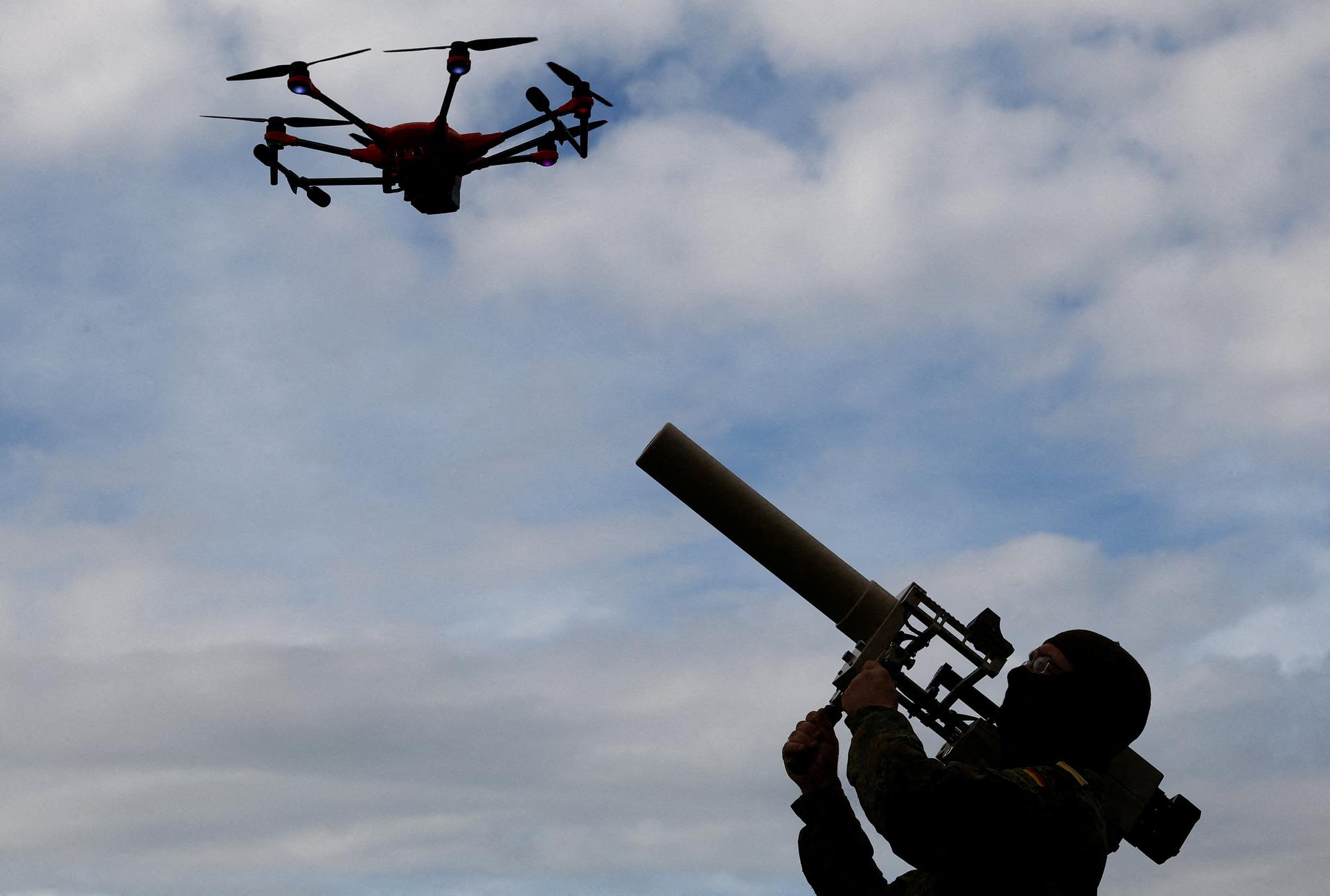A soldier of the German armed forces demonstrates a HP 47 drone jammer during the defence exercise 