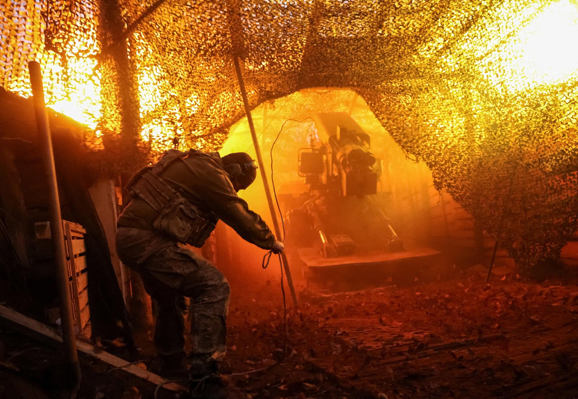 A Ukrainian serviceman fires a howitzer near Kostiantynivka, Ukraine, November 2025