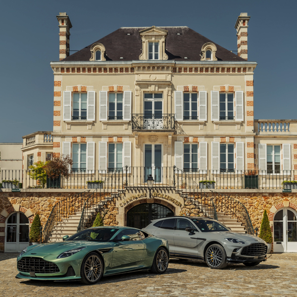 Aston Martins in front of a chateau