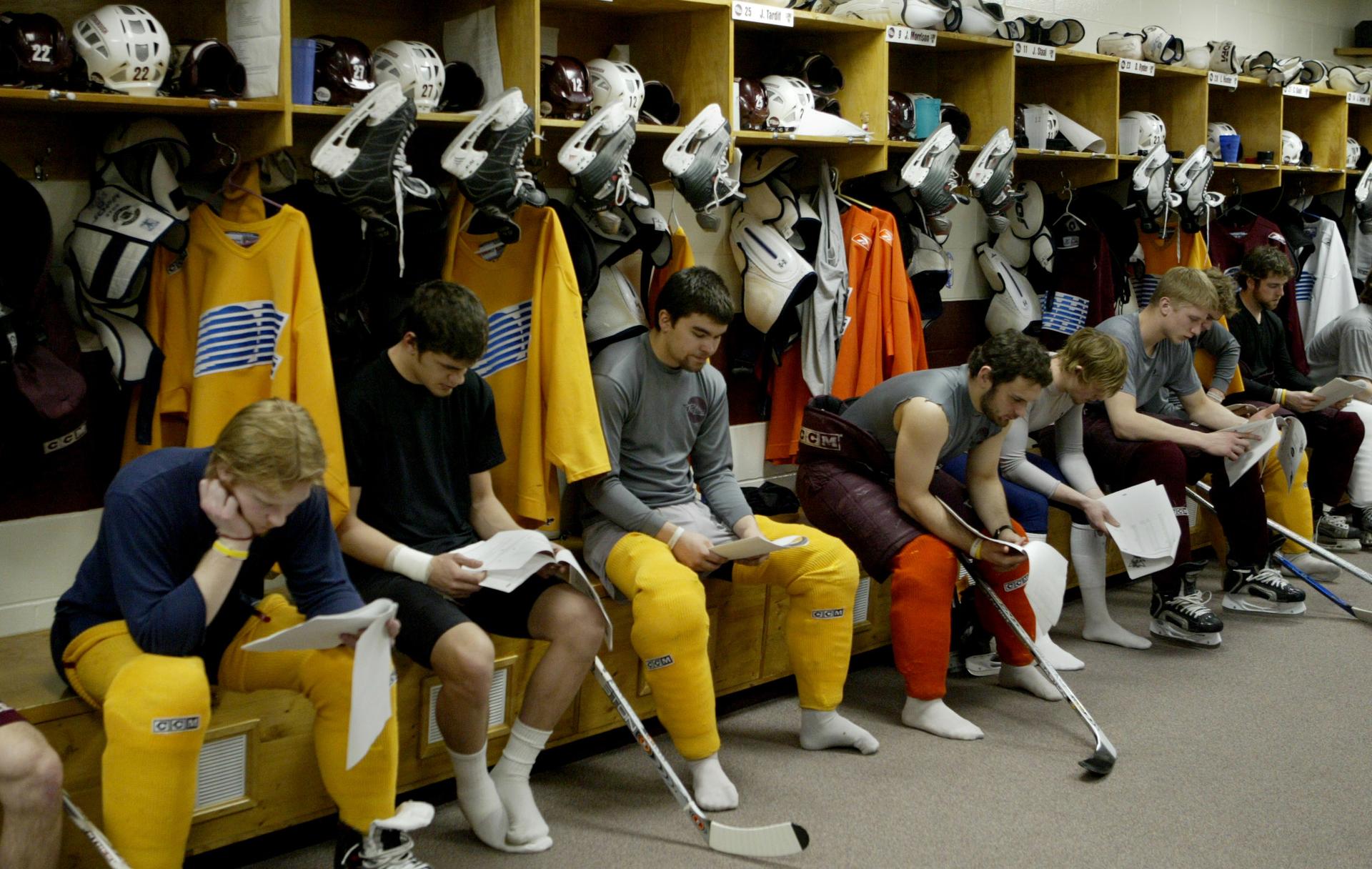 Members of the Peterborough Petes study game notes in their locker room stalls, in 2005.