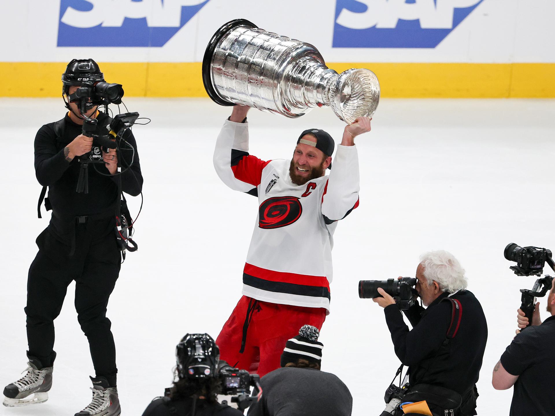 Jordan Staal, of the Carolina Hurricanes, hoists the Stanley Cup after the team's 3-0 victory over the Vegas Golden Knights.