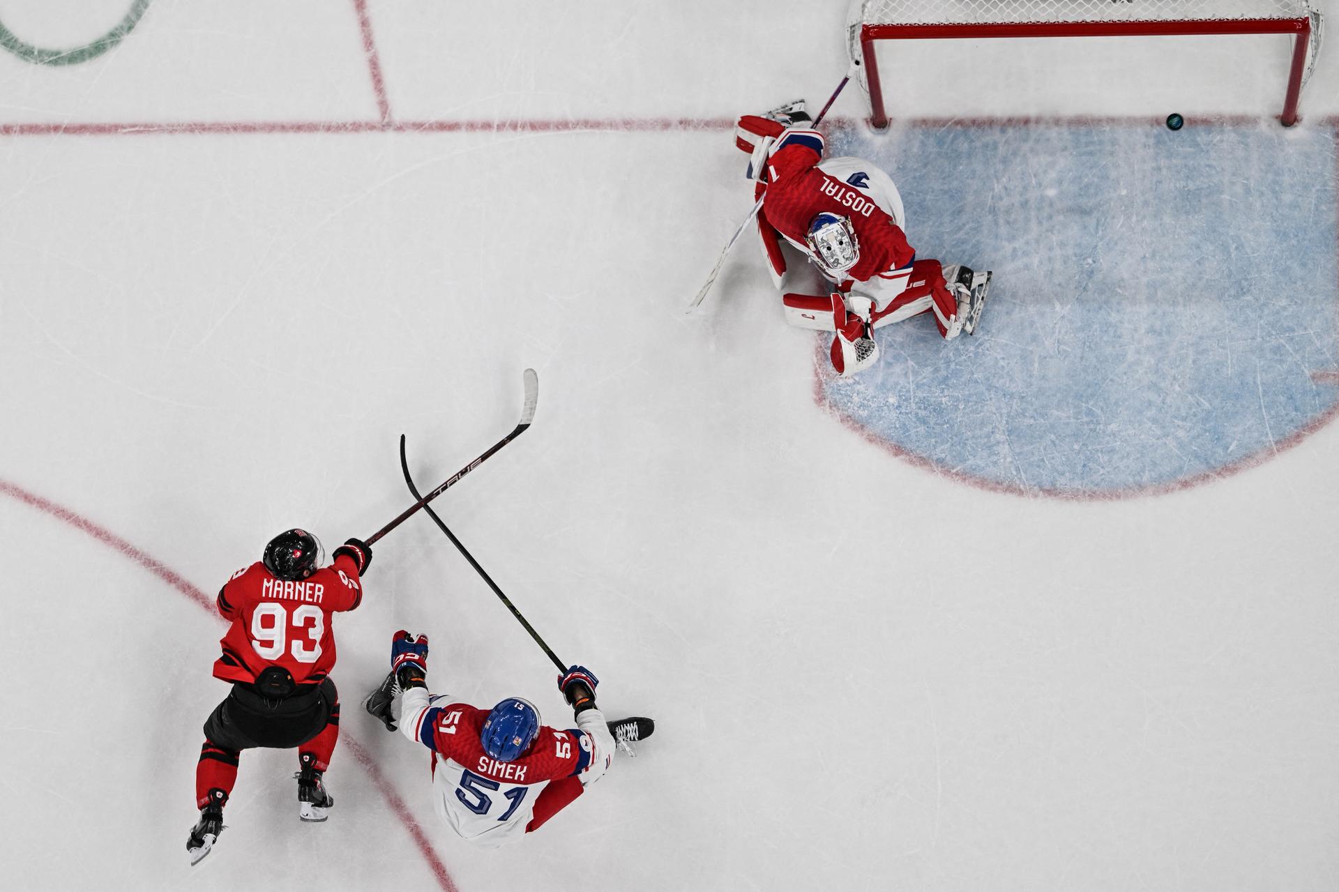 Canada's Mitch Marner scores the overtime winner over Czechia in a quarterfinal game at the Milan-Cortina Games.