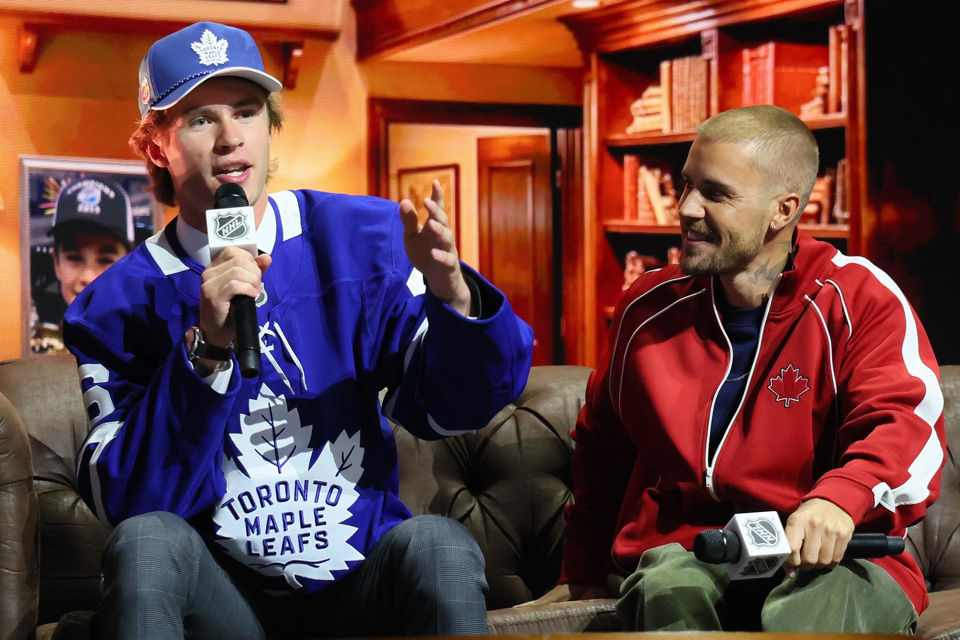 Toronto Maple Leafs draft pick Gavin McKenna chats with singer Justin Bieber at the NHL Entry Draft. 