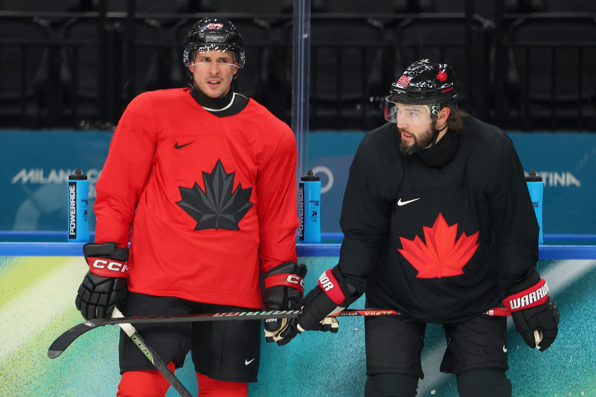 Drew Doughty and Sidney Crosby share a moment between drills with Team Canada at the Milan-Cortina Games.