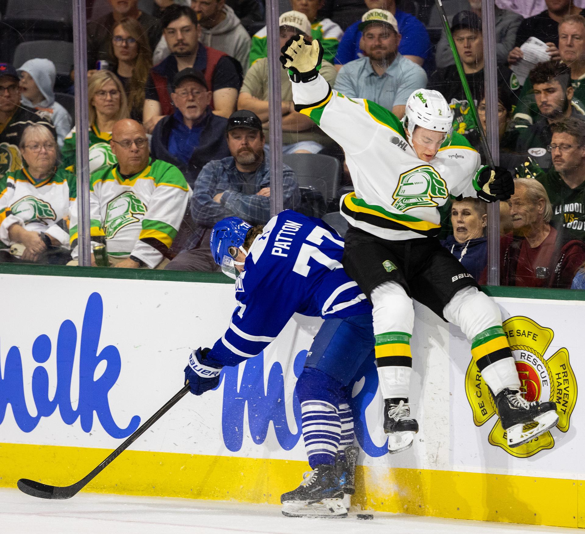 Henry Brzustewicz of the London Knights gets some air as he collides with Troy Patton of the Brampton Steelheads during an OHL game at Canada Life Place, in London, Ont..