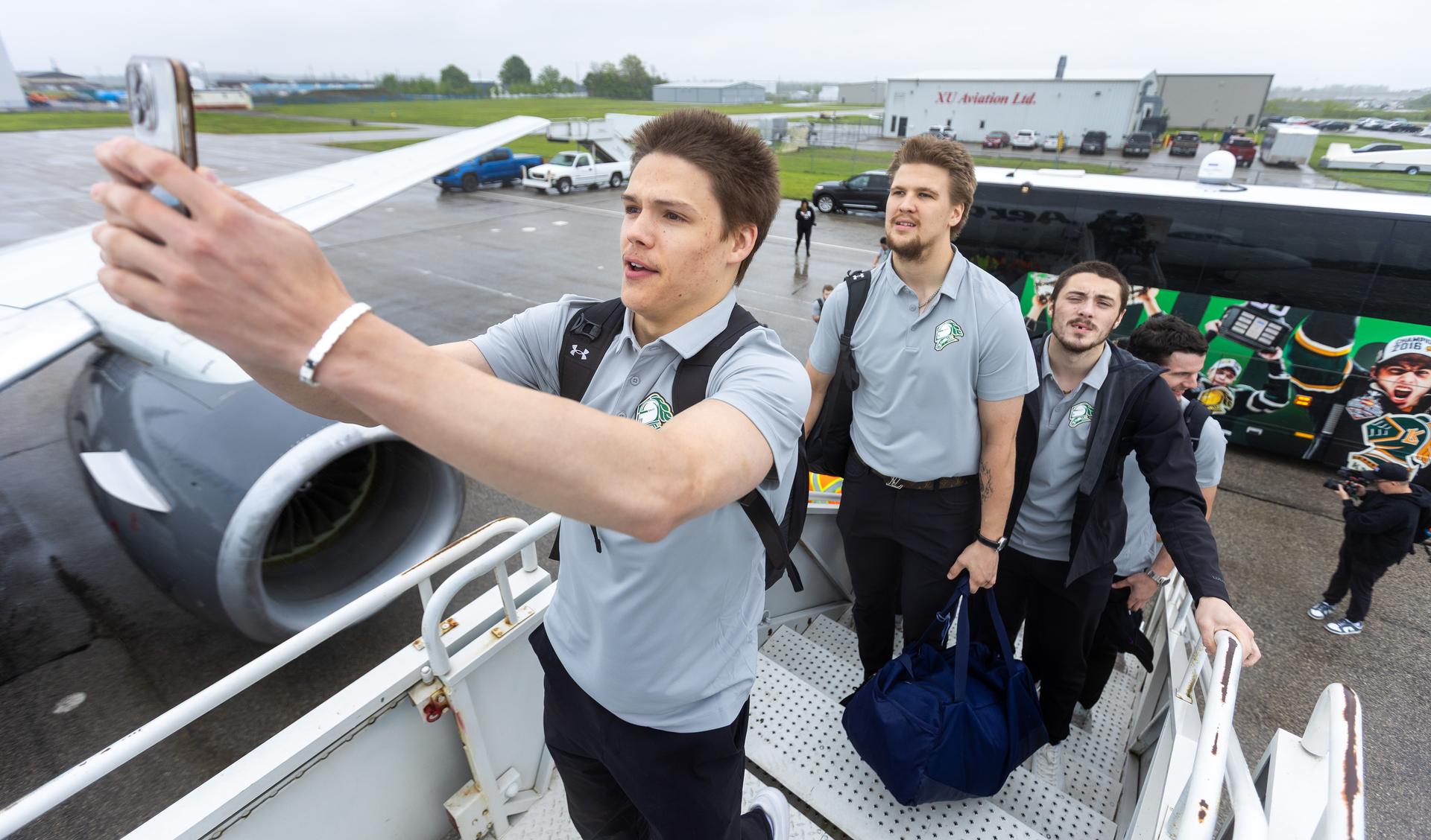NHL prospect Easton Cowan takes a selfie as he boards an airplane with teammates from the London Knights. 