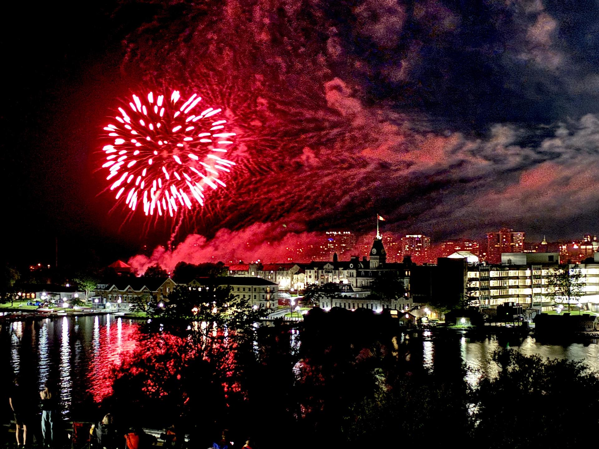 fireworks over a downtown city scape