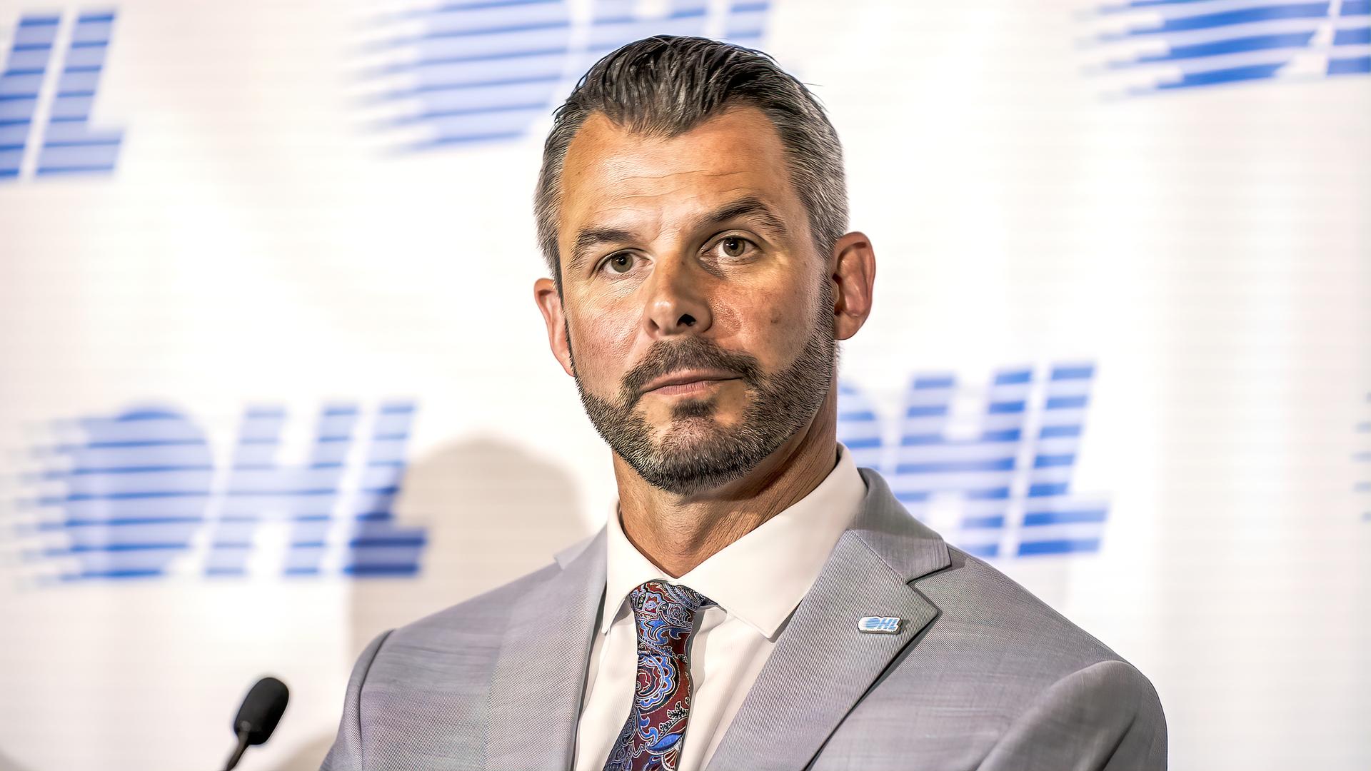 Ontario Hockey League commissioner Bryan Crawford fields a question during a media event.