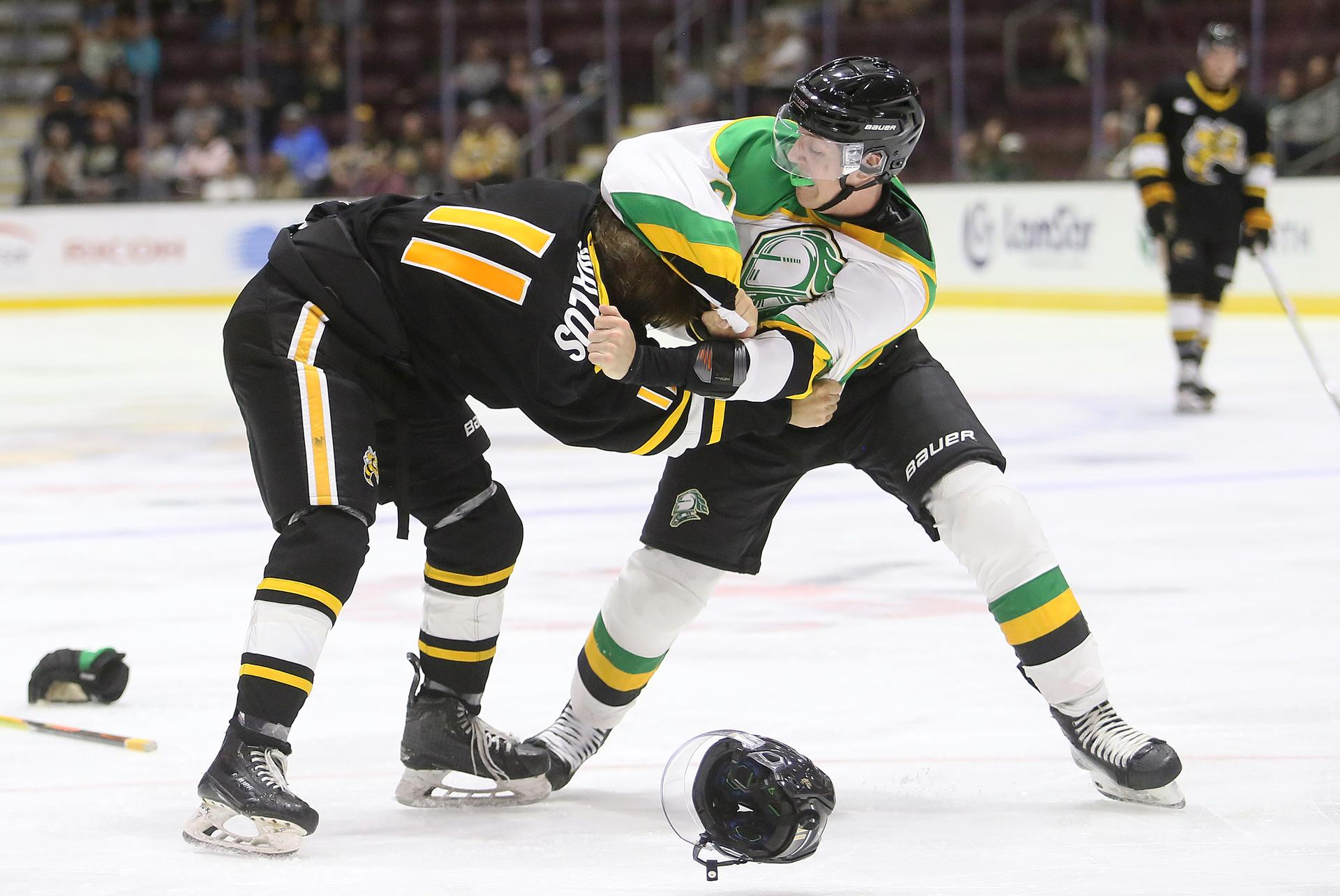 Sarnia's Easton Walos and London's Cohen Bidgood exchange punches during an OHL pre-season game. 