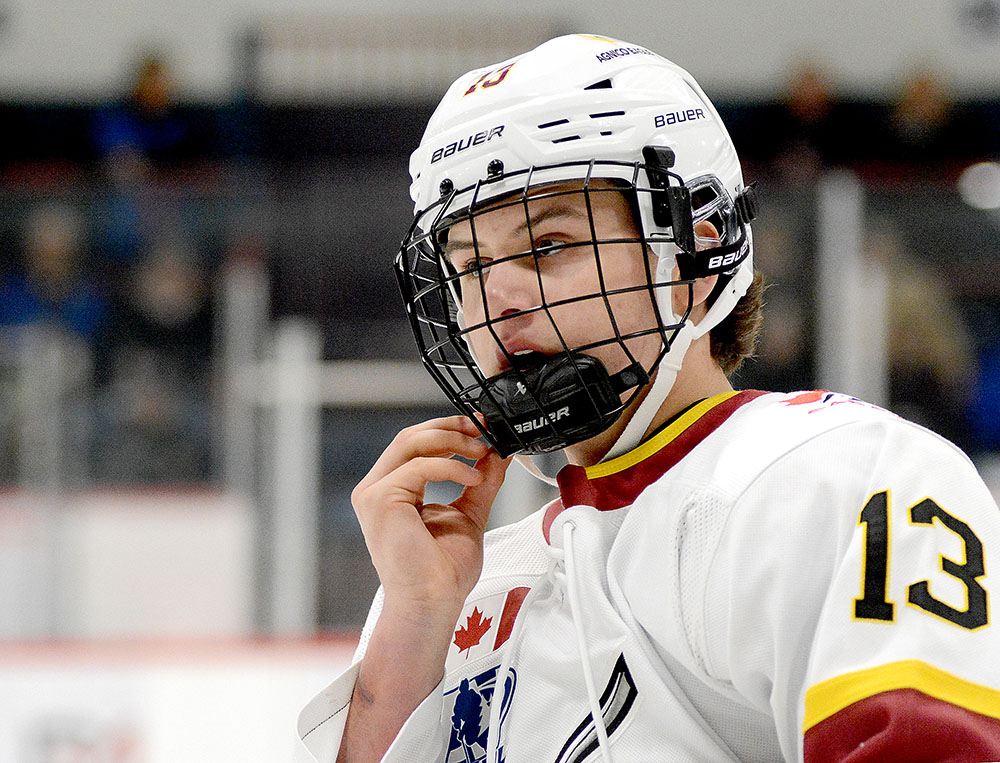 OHL prospect Tanner Adams adjusts his helmet during a game.