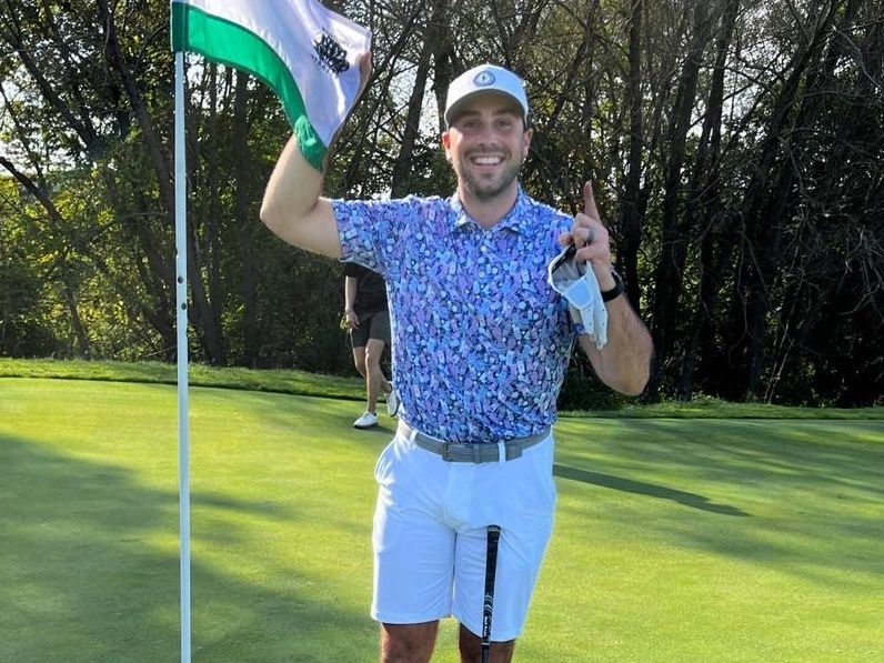 Former OHL player Mike Robinson on a golf course in Wisconsin, hours before his murder in the small town of Sheboygan Falls.