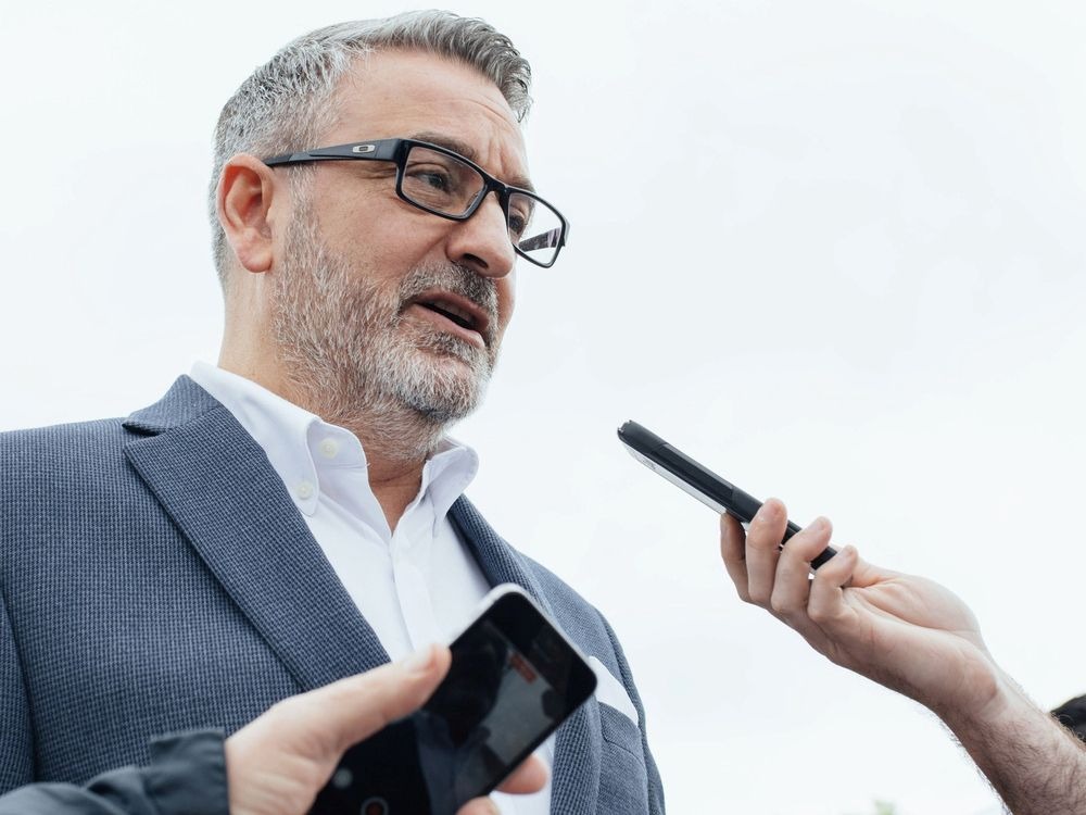 Ontario Education Minister Paul Calandra answers reporter questions