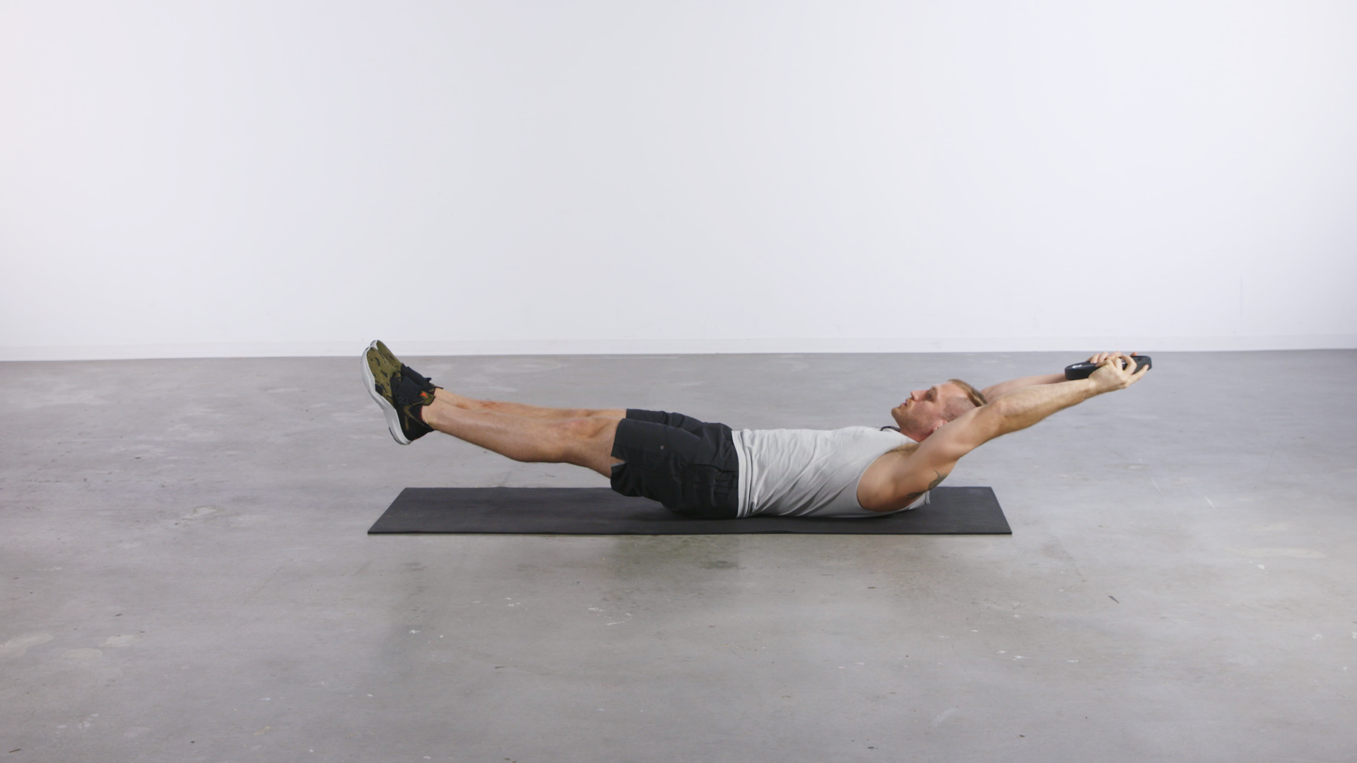 man performing a hollow hold