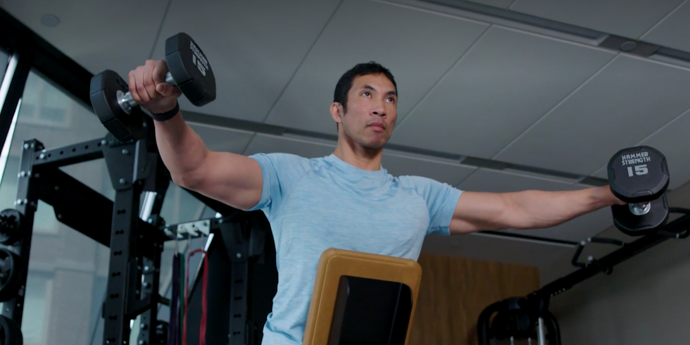 Ebenezer Samuel doing bench-supported dumbbell lateral raise