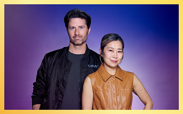 Maggie Kang and Chris Appelhans posing for a photo.