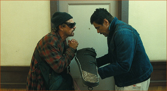 A still of Leonardo DiCaprio and Benicio Del Toro acting in ONE BATTLE AFTER ANOTHER.