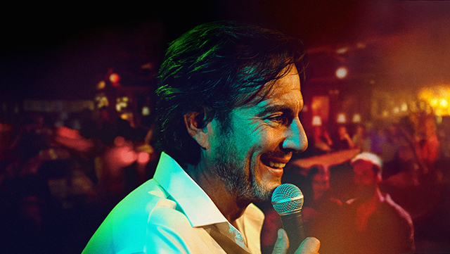 A still of Will Arnett doing stand-up comedy in IS THIS THING ON?