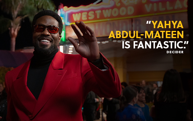 A person wearing red waving. Text over reads: 'Yahya Abdul-Mateen is fantastic.' Decider.