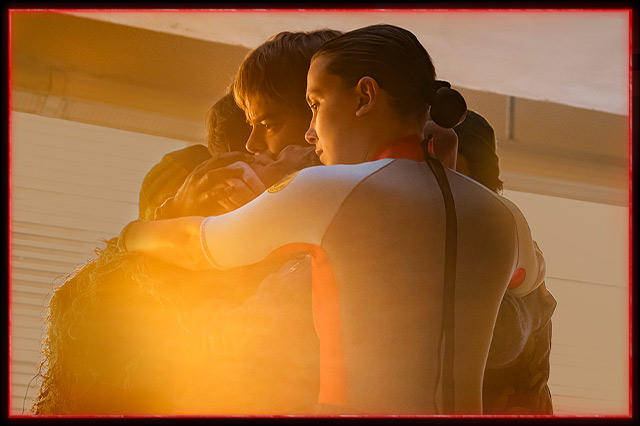 Characters hugging in STRANGER THINGS.