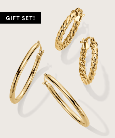 Two pairs of yellow gold hoop earrings featured as a gift set.