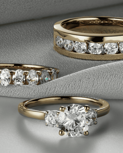 Yellow gold diamond rings featuring solitaire and eternity band styles.