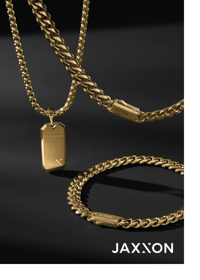 A yellow gold tag pendant necklace with matching curb chain necklace and bracelet.
