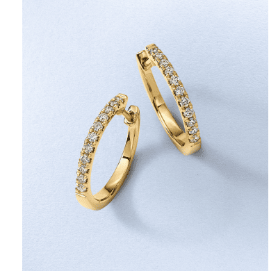 White gold spiral stud earrings accented with round diamonds.