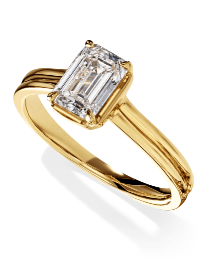 Yellow gold bezel-set emerald-cut diamond solitaire engagement ring.