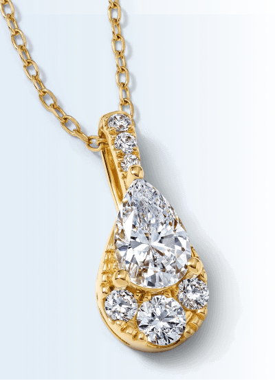 A pear-shaped diamond teardrop pendant in yellow gold with round diamond accents and a diamond bail.
