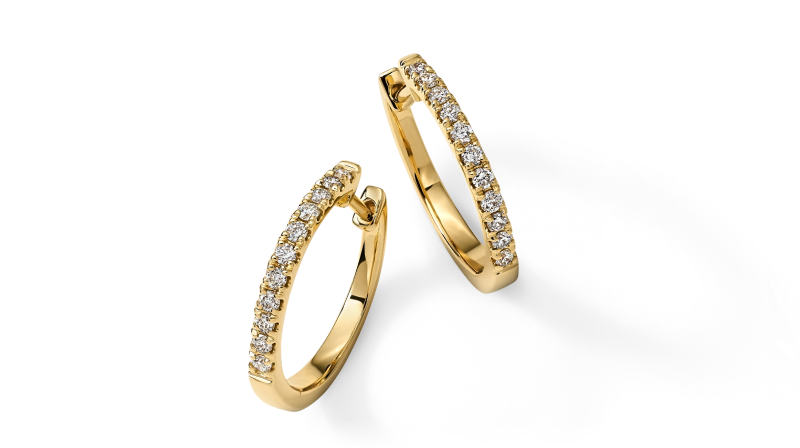 Yellow gold hoop earrings with rows of round diamonds.
