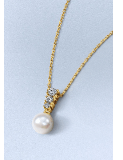 Yellow gold necklace with a pearl pendant and diamond accents.