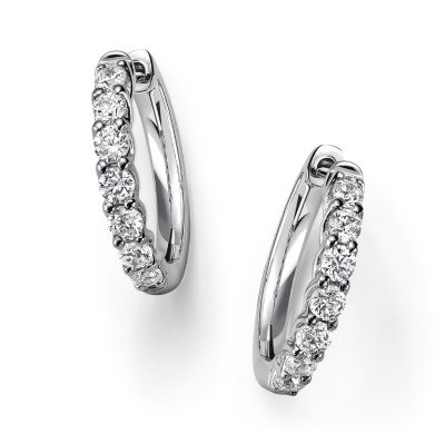 Diamond hoop earrings in polished white metal.
