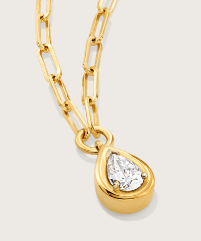 Yellow gold necklace featuring a bezel-set pear-shaped diamond.