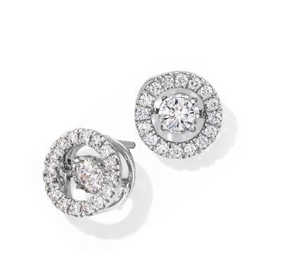 White gold stud earrings with round diamond center and halo of diamonds.