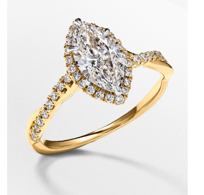 Yellow gold engagement ring with a marquise-cut diamond center stone, halo and pavé band.