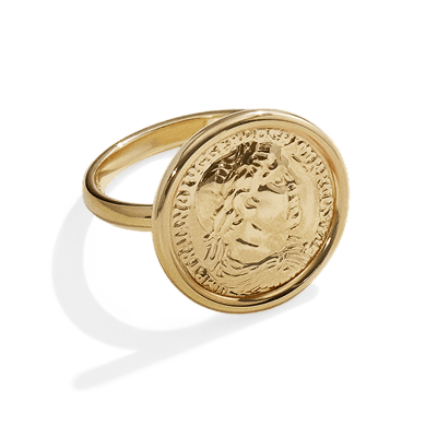 Yellow gold signet ring featuring a round engraved coin-inspired design.