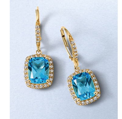 Yellow gold drop earrings with cushion-cut blue stones surrounded by round-cut diamond halos.
