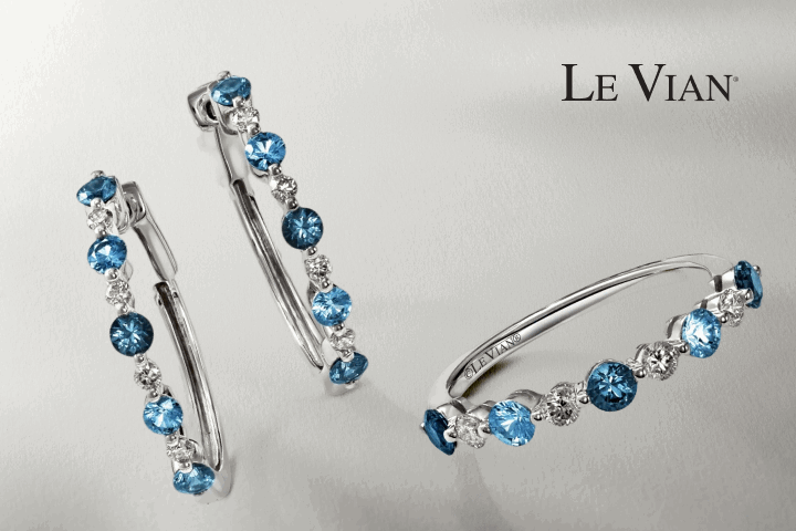 Le Vian blue gemstone earrings and matching ring. Bulova watch with mother-of-pearl dial. Name bracelet with blue gemstone.
