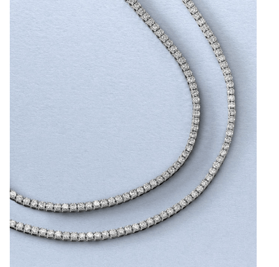 A double-strand white gold tennis necklace featuring round diamonds.