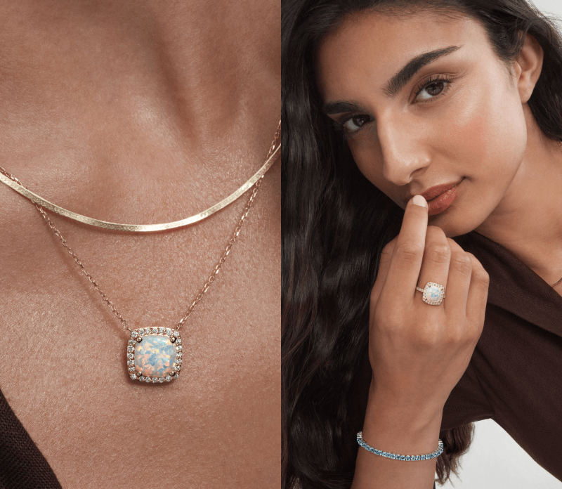 A model wearing an opal halo pendant necklace, opal ring and blue gemstone bracelet.
