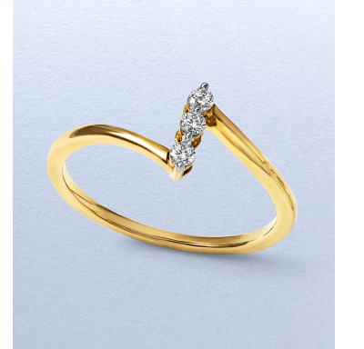 Yellow gold ring featuring a trio of round diamonds in a diagonal setting.