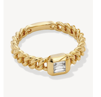 A yellow gold chain ring with a bezel-set baguette diamond center stone.