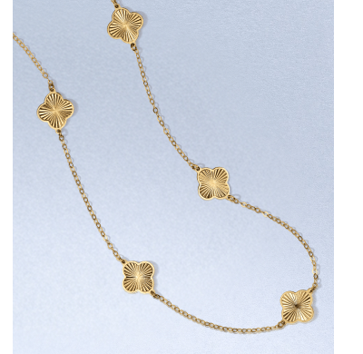 Yellow gold clover station necklace.