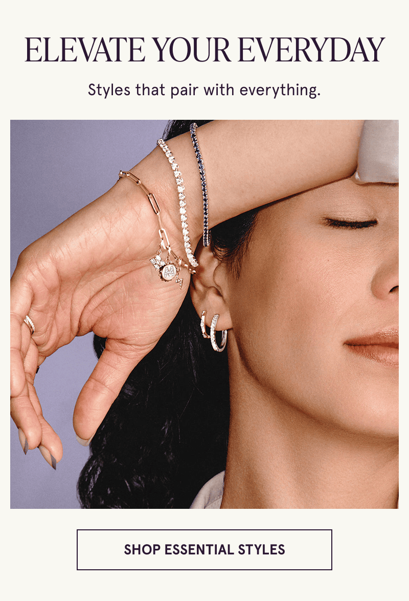 A model wearing gold diamond and gemstone jewelry. Styles that pair with everything. Click here to shop essential styles