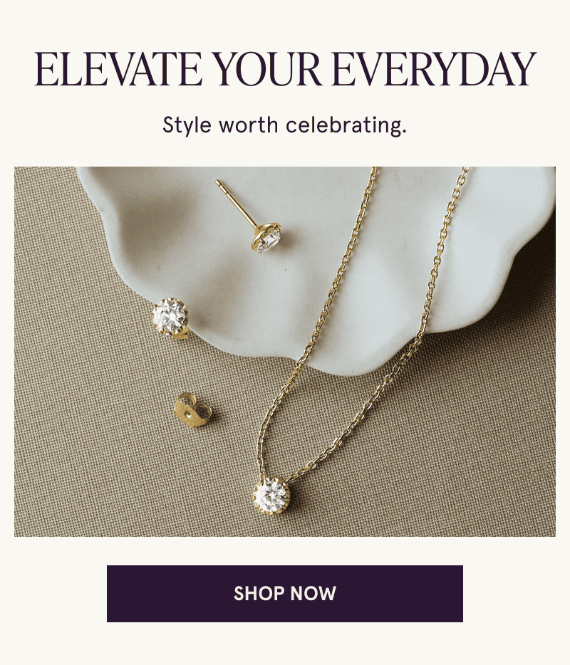 A pair of diamond studs and a matching necklace rest on a jewelry dish. Elevate your everyday. Click here to shop now