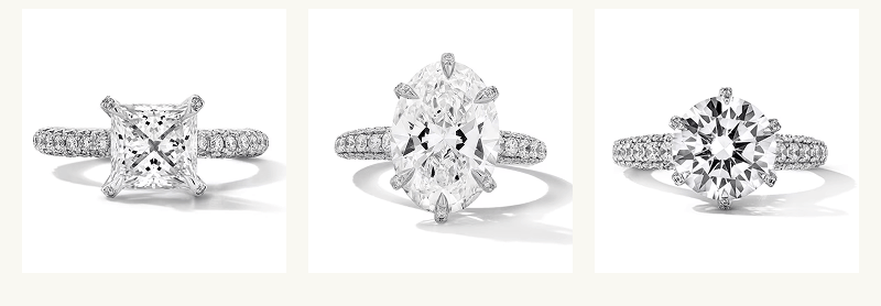 Various shaped diamonds on eternity bands, set in white metal.